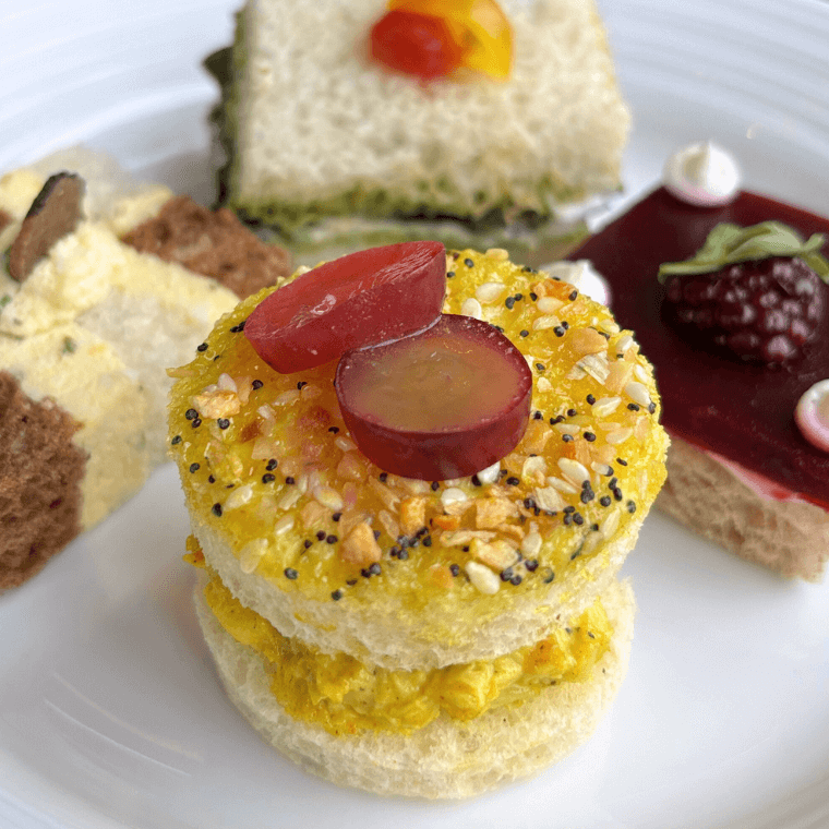 Curry chicken salad, pickled grapes, everything bagel spices, brioche