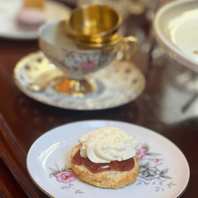 Scone with raspberry preserve and crème Chantilly