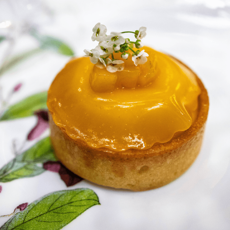 Tropical tartlet, passionfruit curd, mango, kafir lime, white chocolate