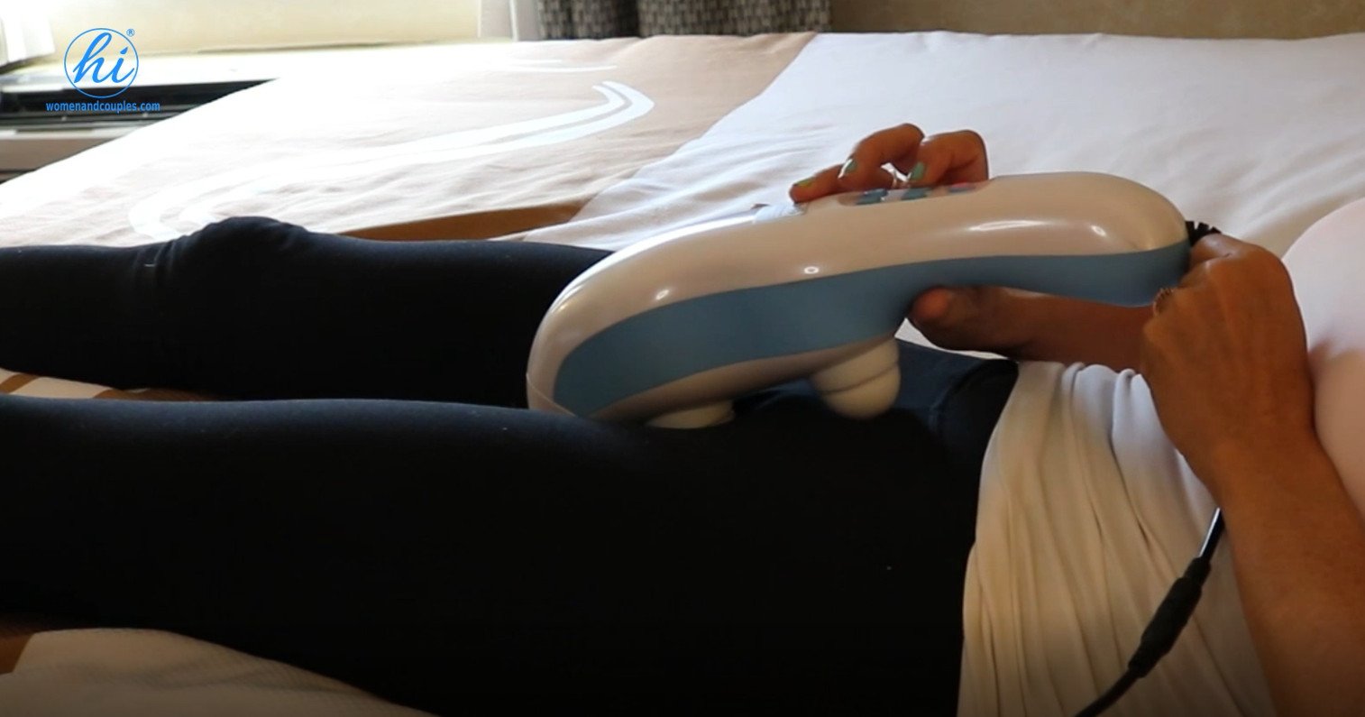 hi® Position 2 — upper pelvic massage, device spanning the pubic symphysis