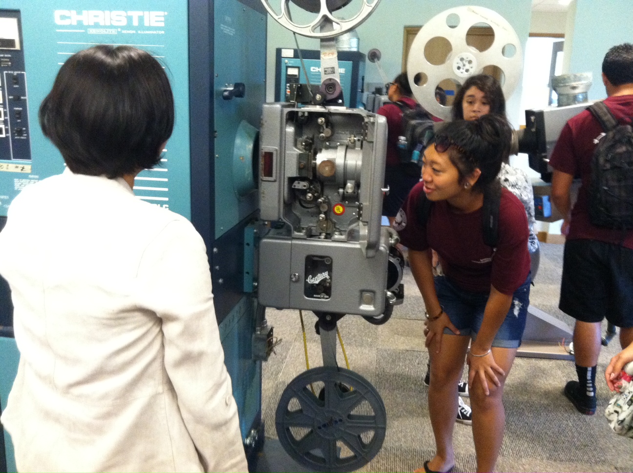 Janel sharing about the projectors w/ the Pueo Program