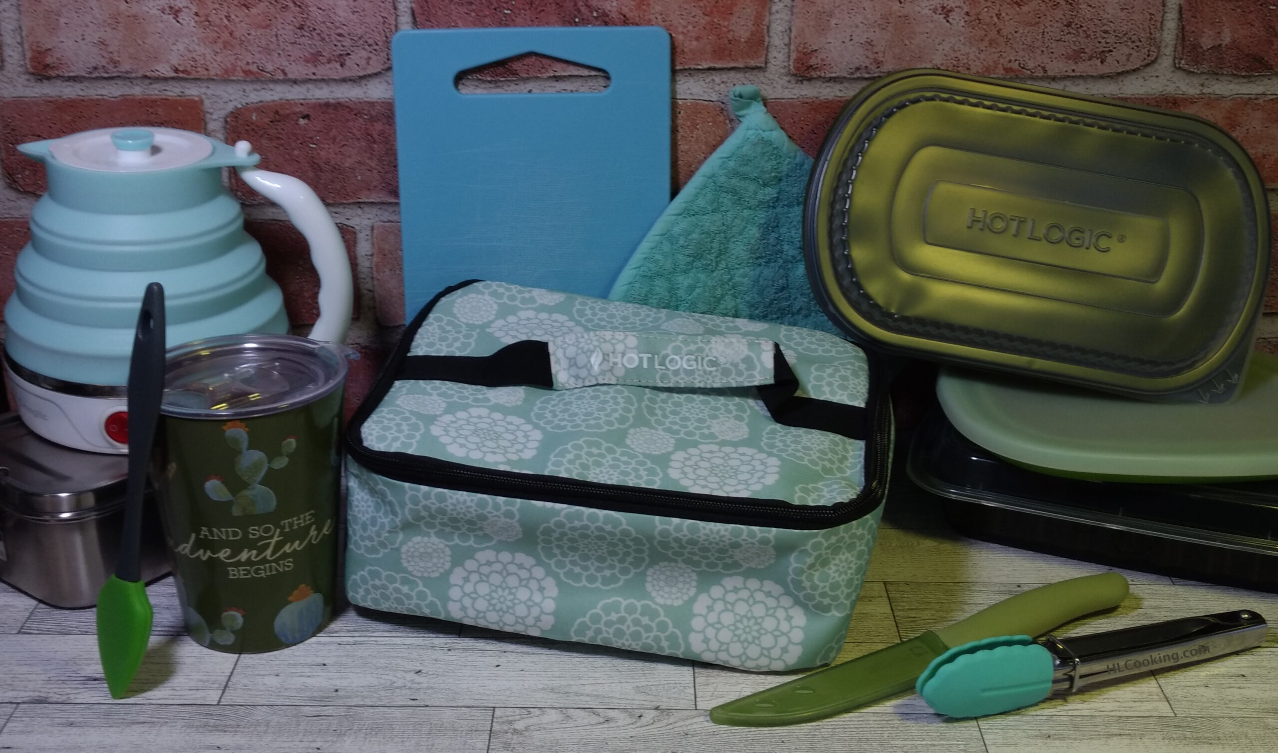 Collection of items to include in a compact kitchen for travel including a HOTLOGIC® Mini.