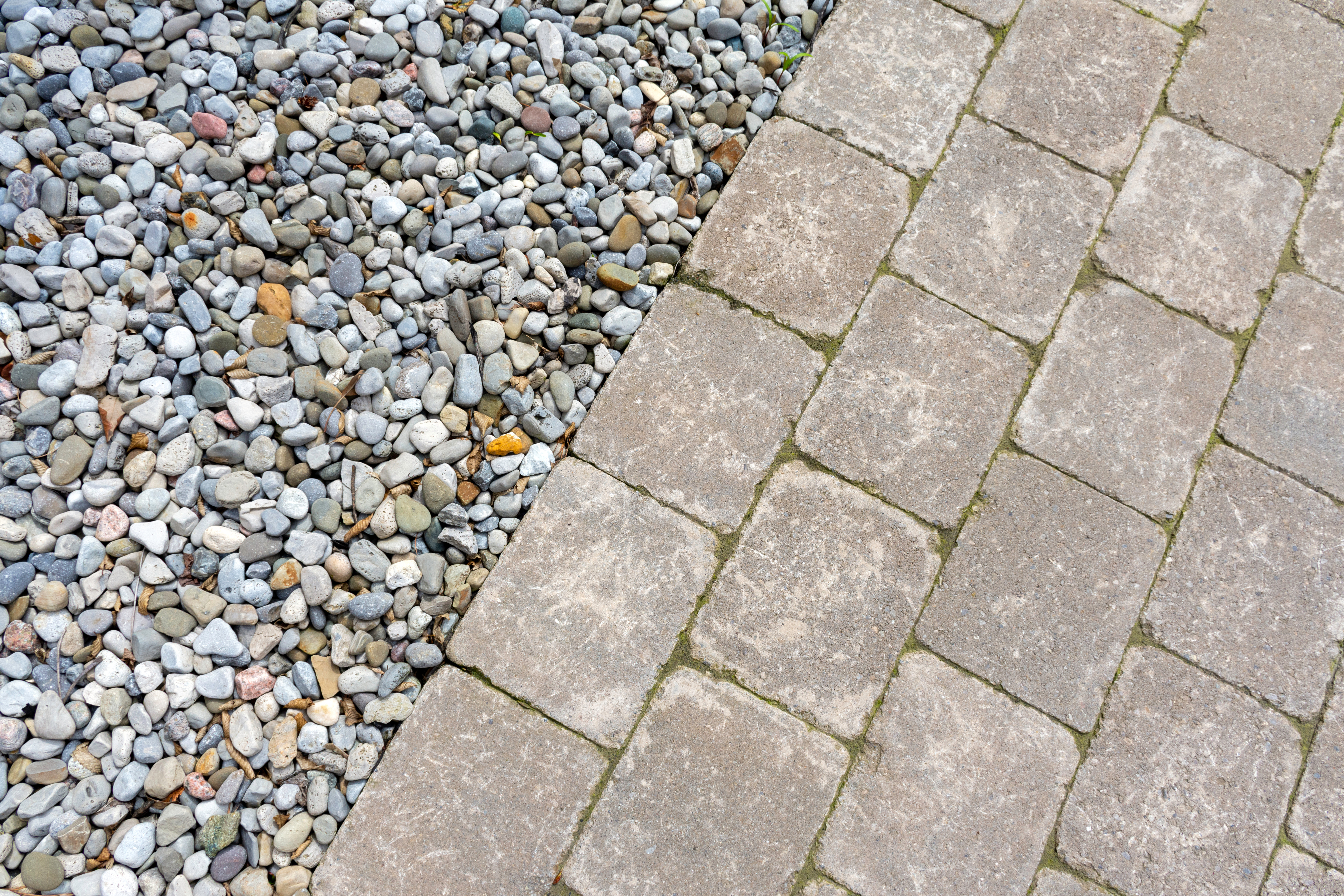 Tumbled paver walkway in the garden with mulch create an interesting landscaping abstract background.
