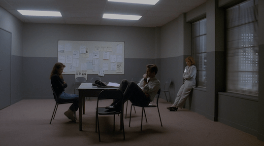 Lauren, Mulder, and Scully sit in an interrogation room.