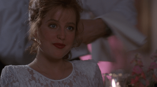 Scully's expression shows that she does not like Rob.