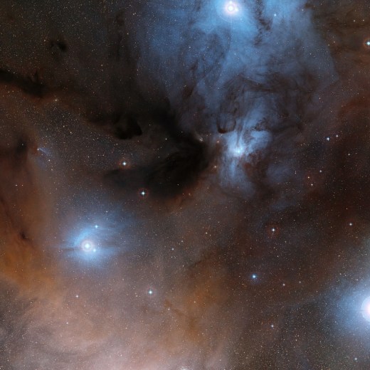 This wide-field view shows a spectacular region of dark and bright clouds, forming part of a region of star formation in the constellation of Ophiuchus (The Serpent Bearer). This picture was created from images in the Digitized Sky Survey 2.