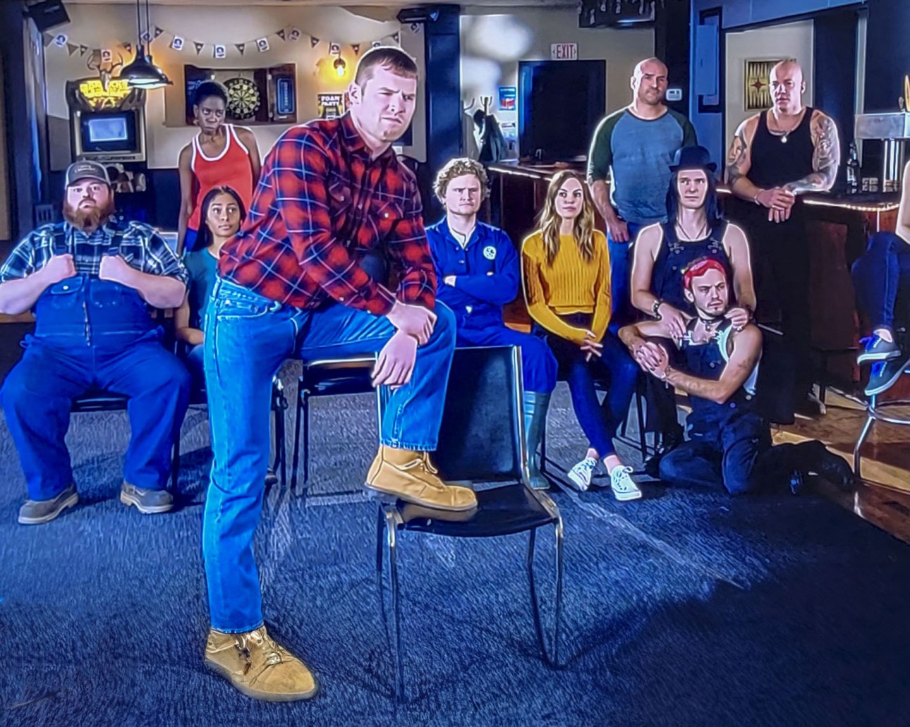 Wayne from Letterkenny standing with his hands on his hips wearing a blue shirt