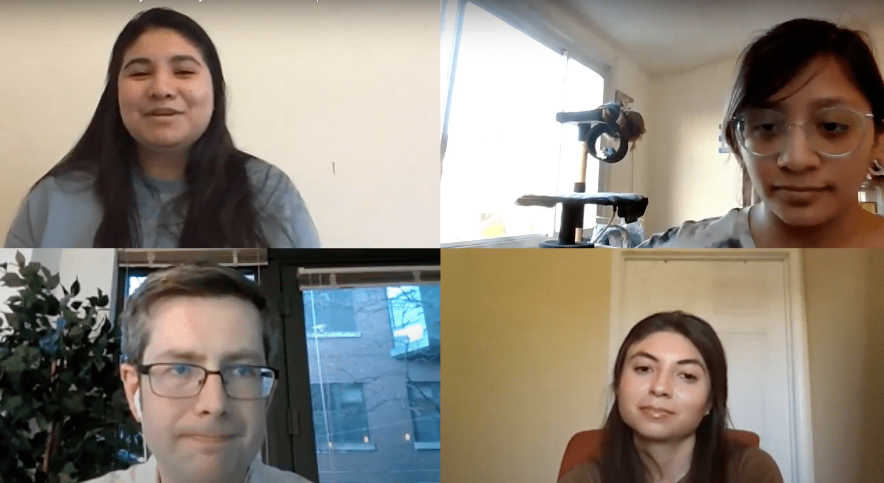 Four people having a conversation over Zoom
