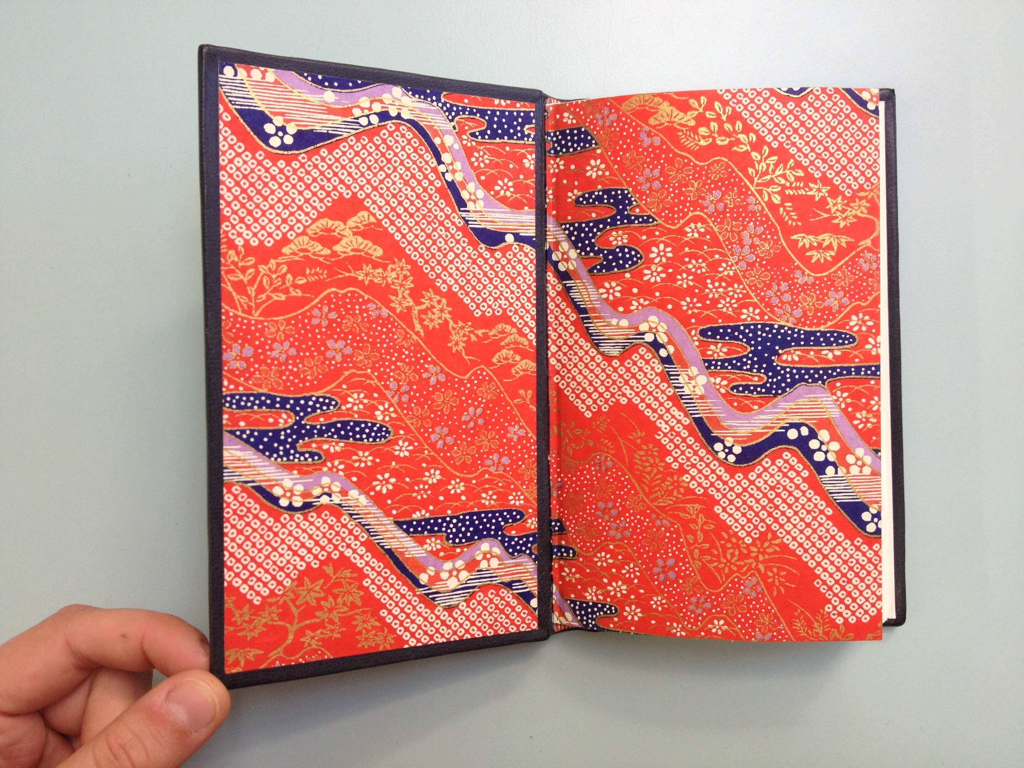 Full goatskin leather binding sewn on 5 raised cords. Decorative Japanese endpapers and a leather doublure.