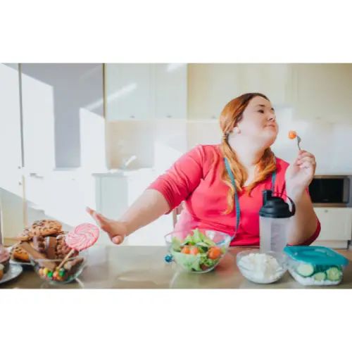 Woman dening herself food.