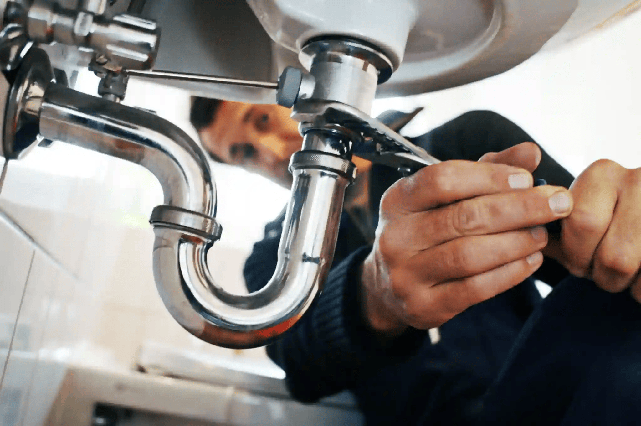 Licensed plumber performing residential plumbing work for Home Experts LLC in Indianapolis