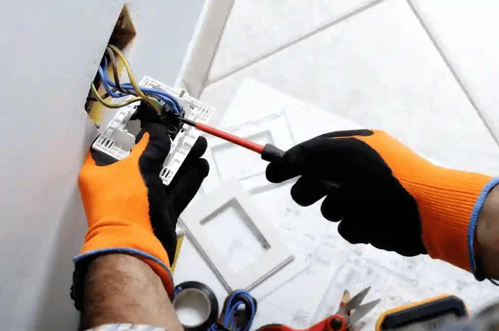 Licensed electrician performing residential electrical work for Home Experts LLC in Indianapolis