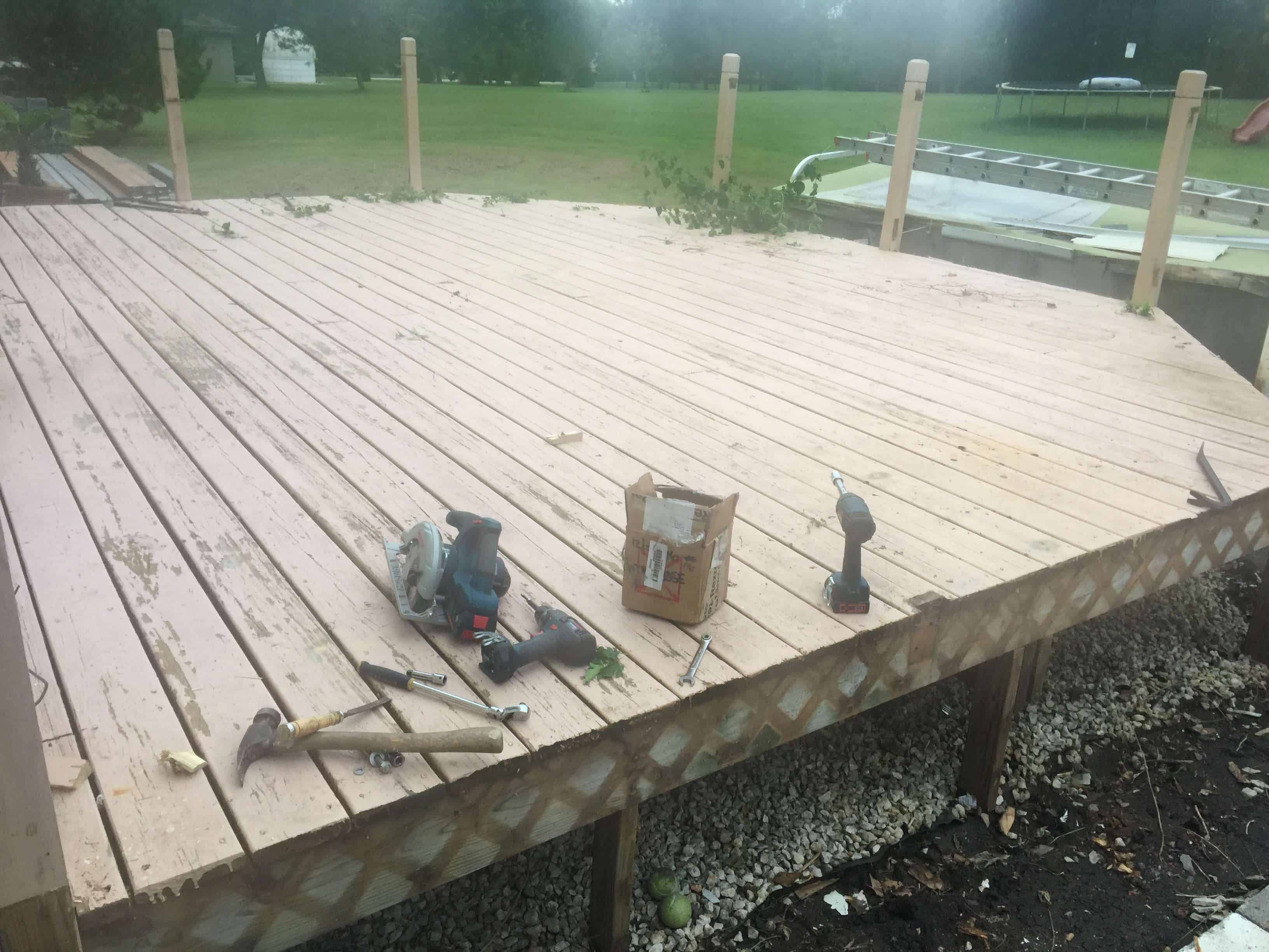 Picture-frame composite deck border being installed with mitered corners