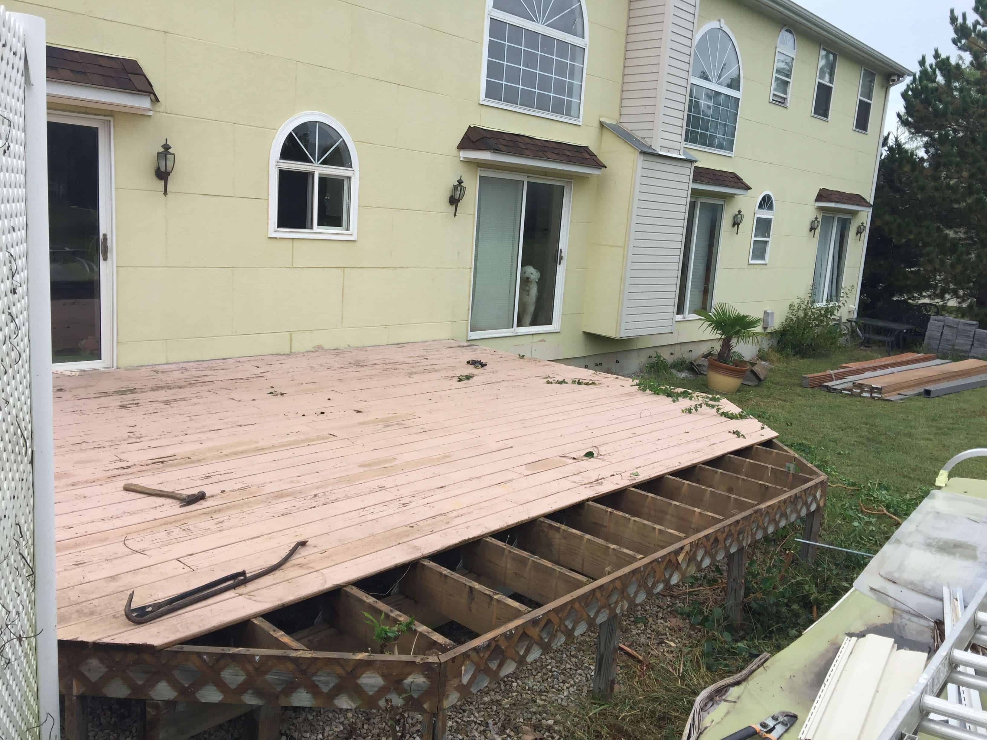Two-tone composite deck field boards being installed with Trex hidden fasteners