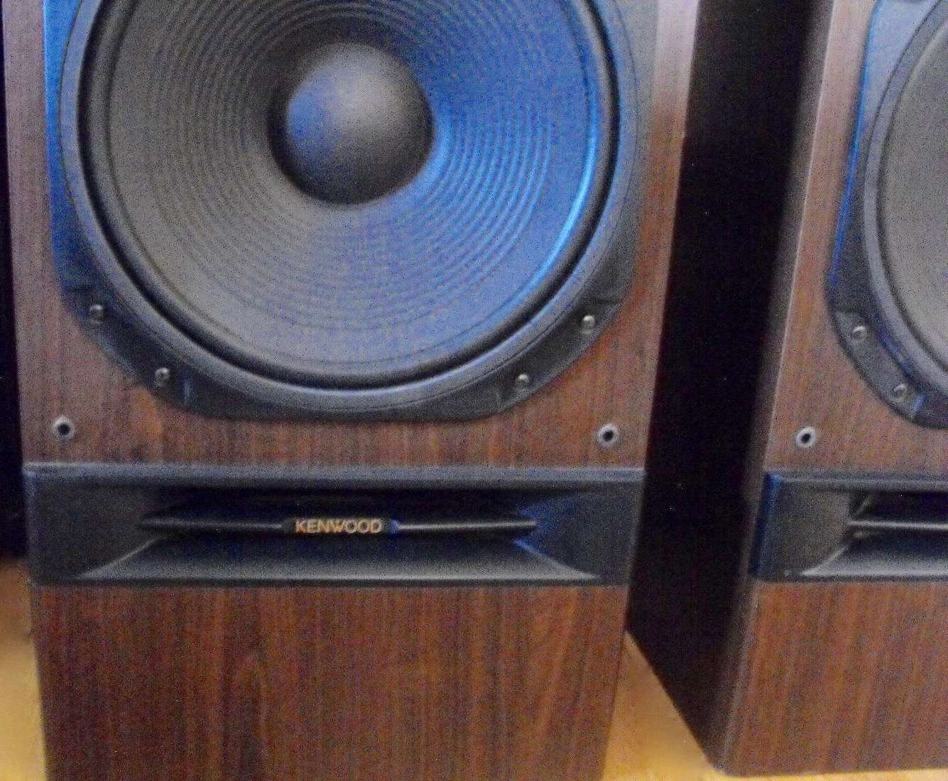 Finished restored Kenwood speaker pair showing new grille cloth and refinished cabinet