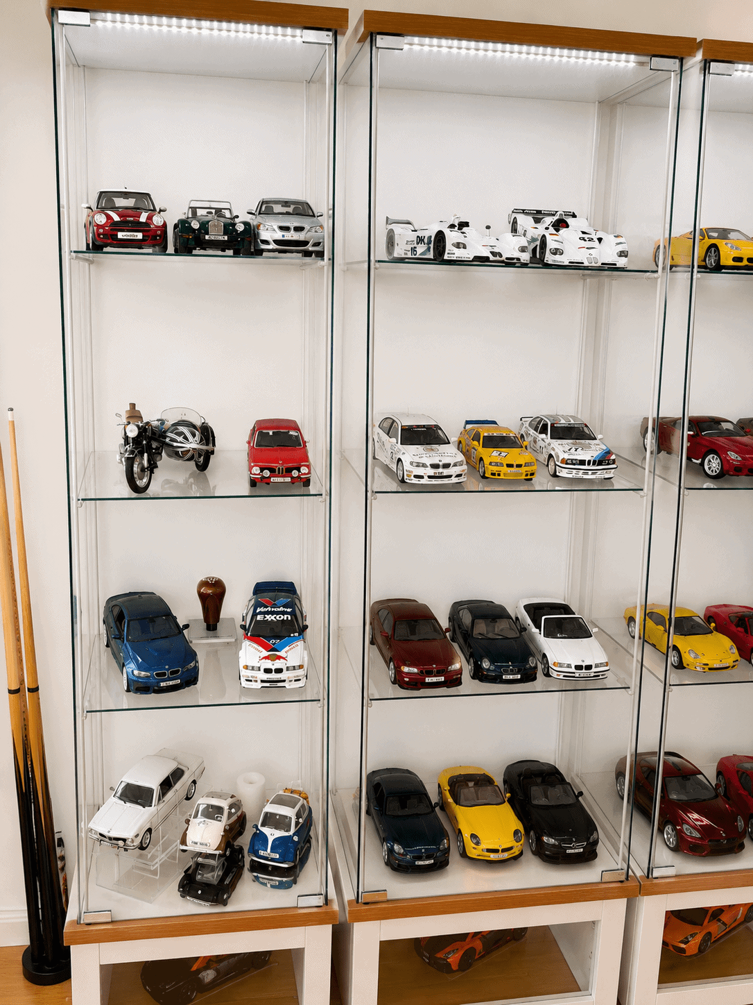Die-cast car collection on an IKEA display