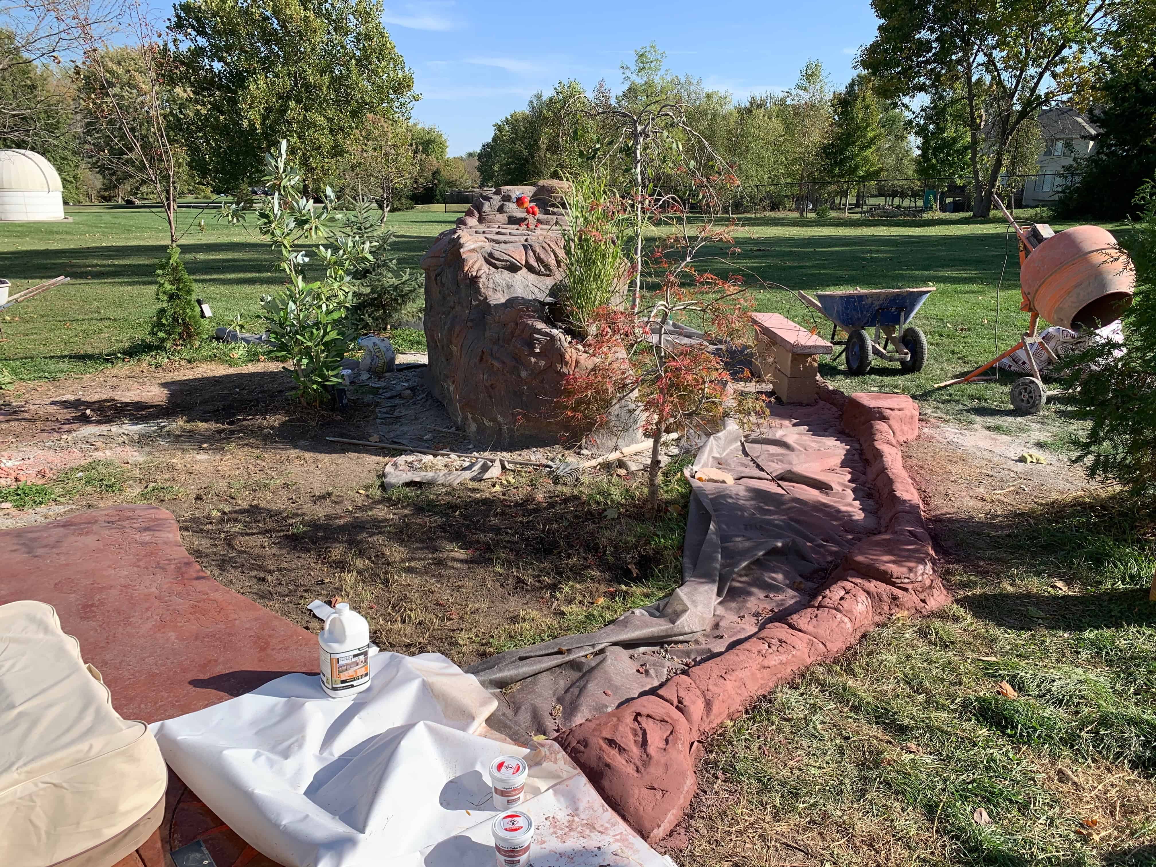 DIY decorative concrete practice boulder in the garden.