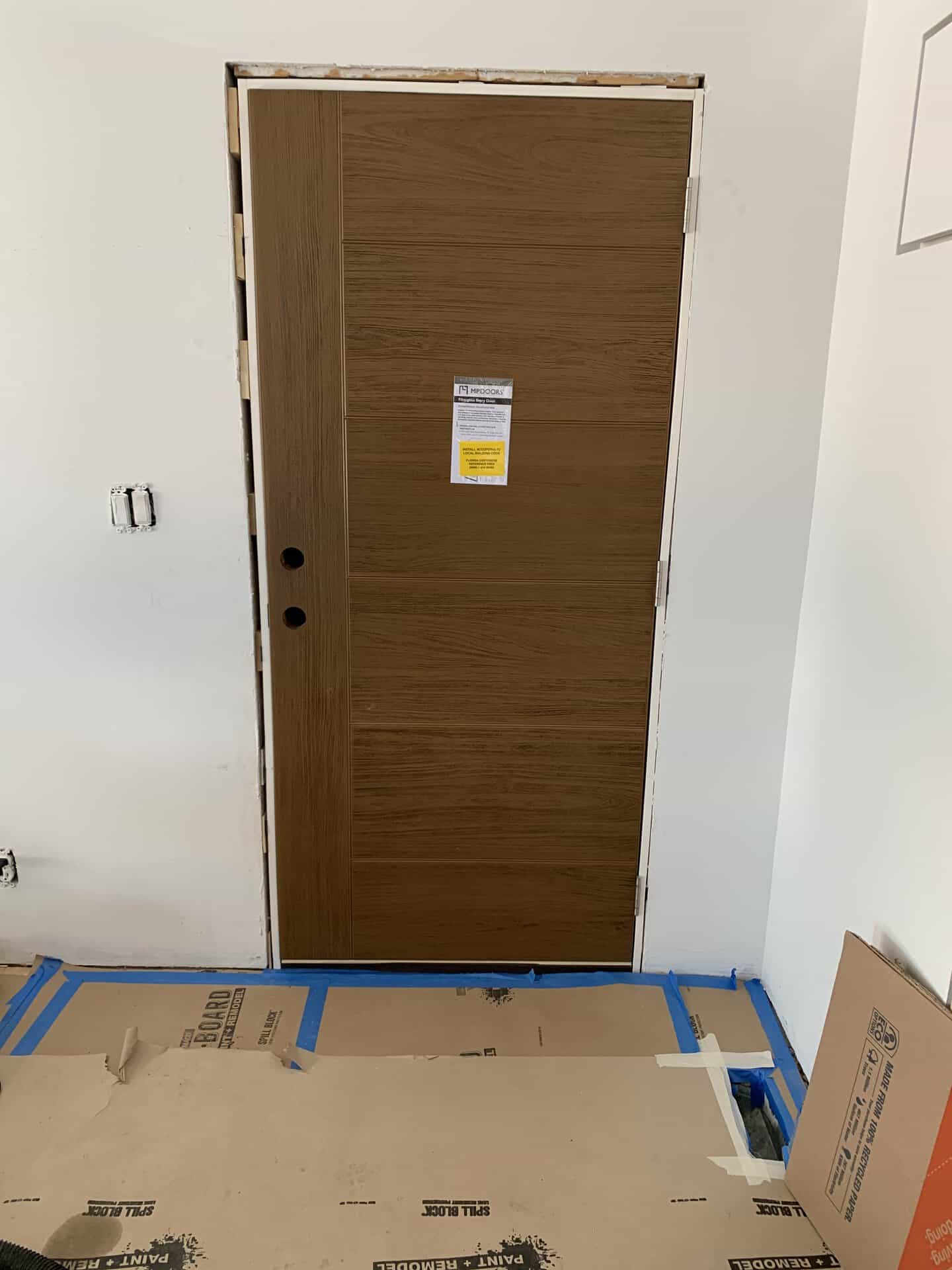 New wooden interior door installed in a modern home interior.