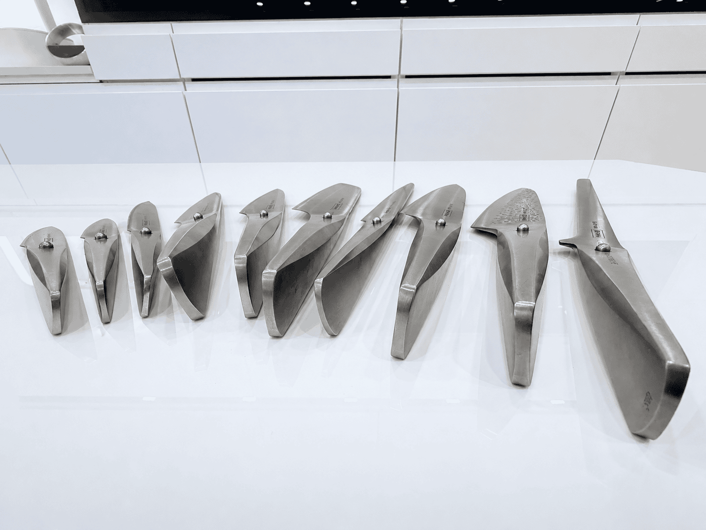 Chroma Type 301 knives by F.A. Porsche laid out on a quartz countertop