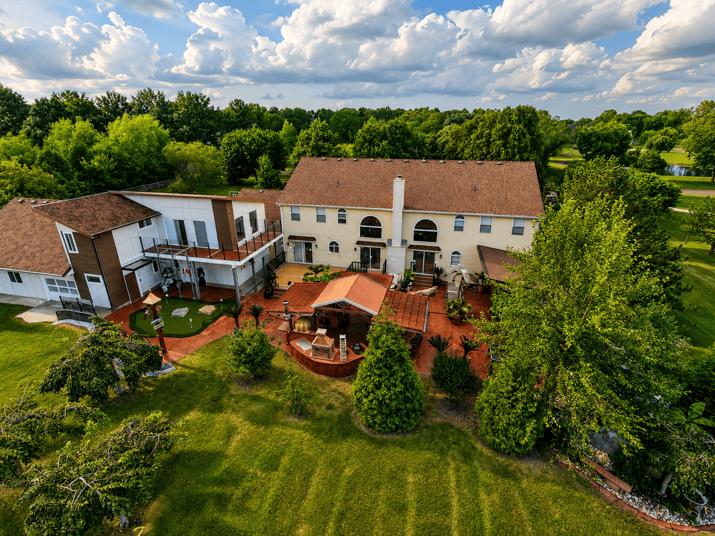 Aerial view of a 64x32 DIY stamped concrete patio with gazebo, outdoor kitchen and putting green