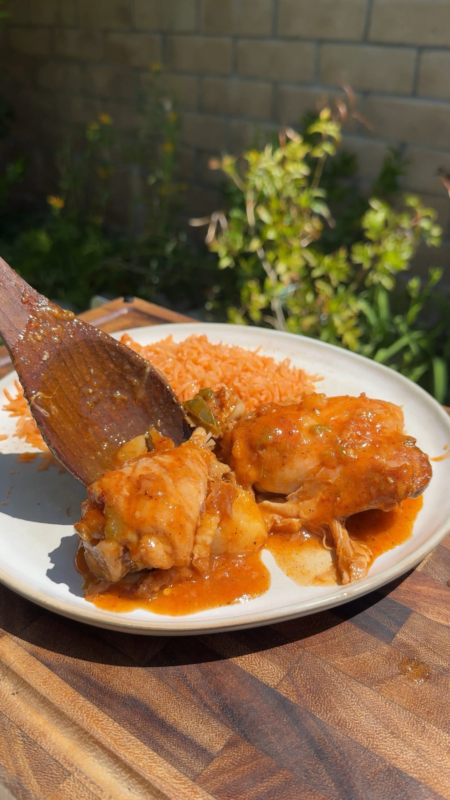 Serving the Chicken stew with rice and potatoes