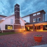 outside photo of Home of the Innocents Children's Commons building during the evening
