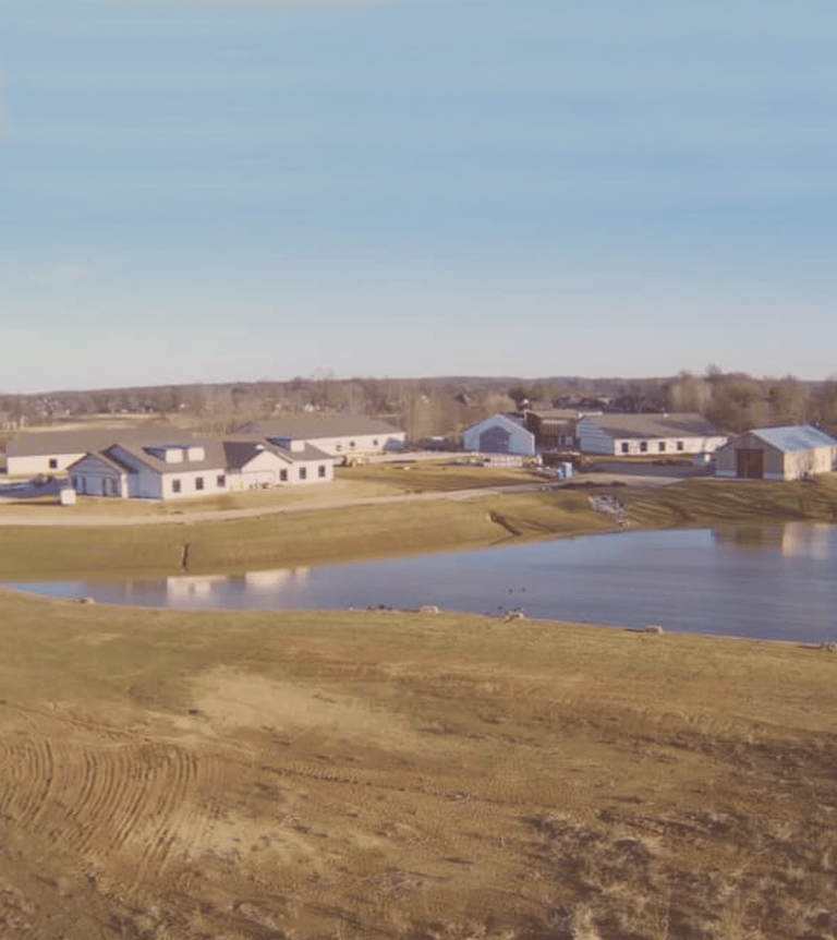 View of Homeplace buildings across an open field