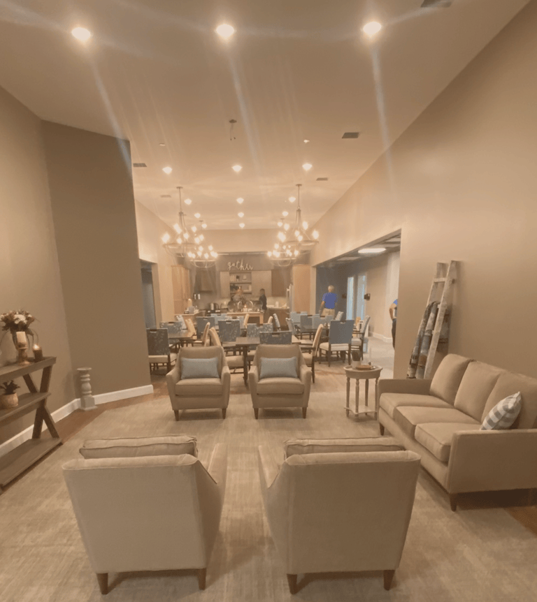 A furnished Homeplace sitting area with sofas and armchairs