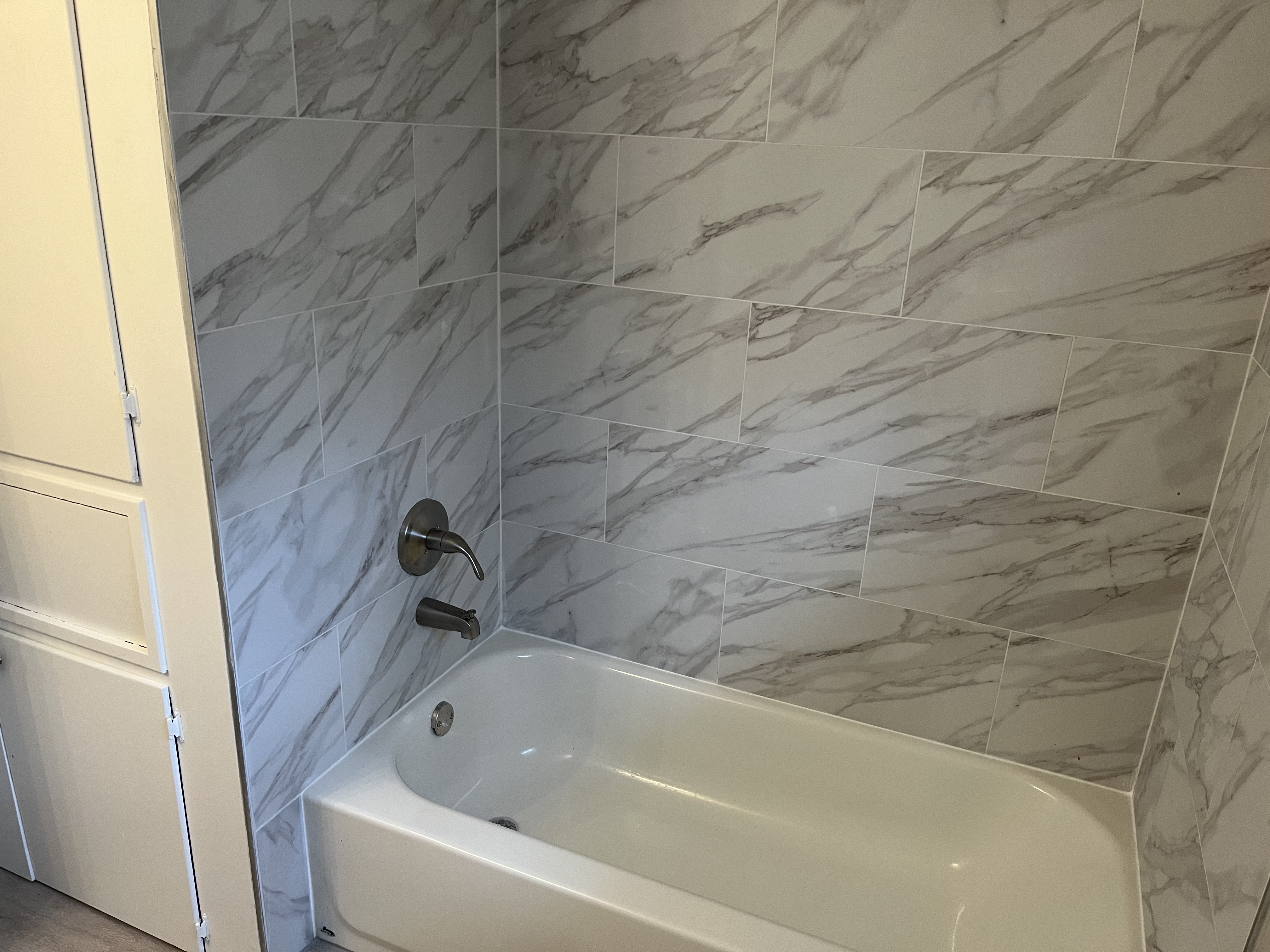 The secondary bathroom has a ton of room and all new vanity, toilet, fixtures and shower/tub combo.