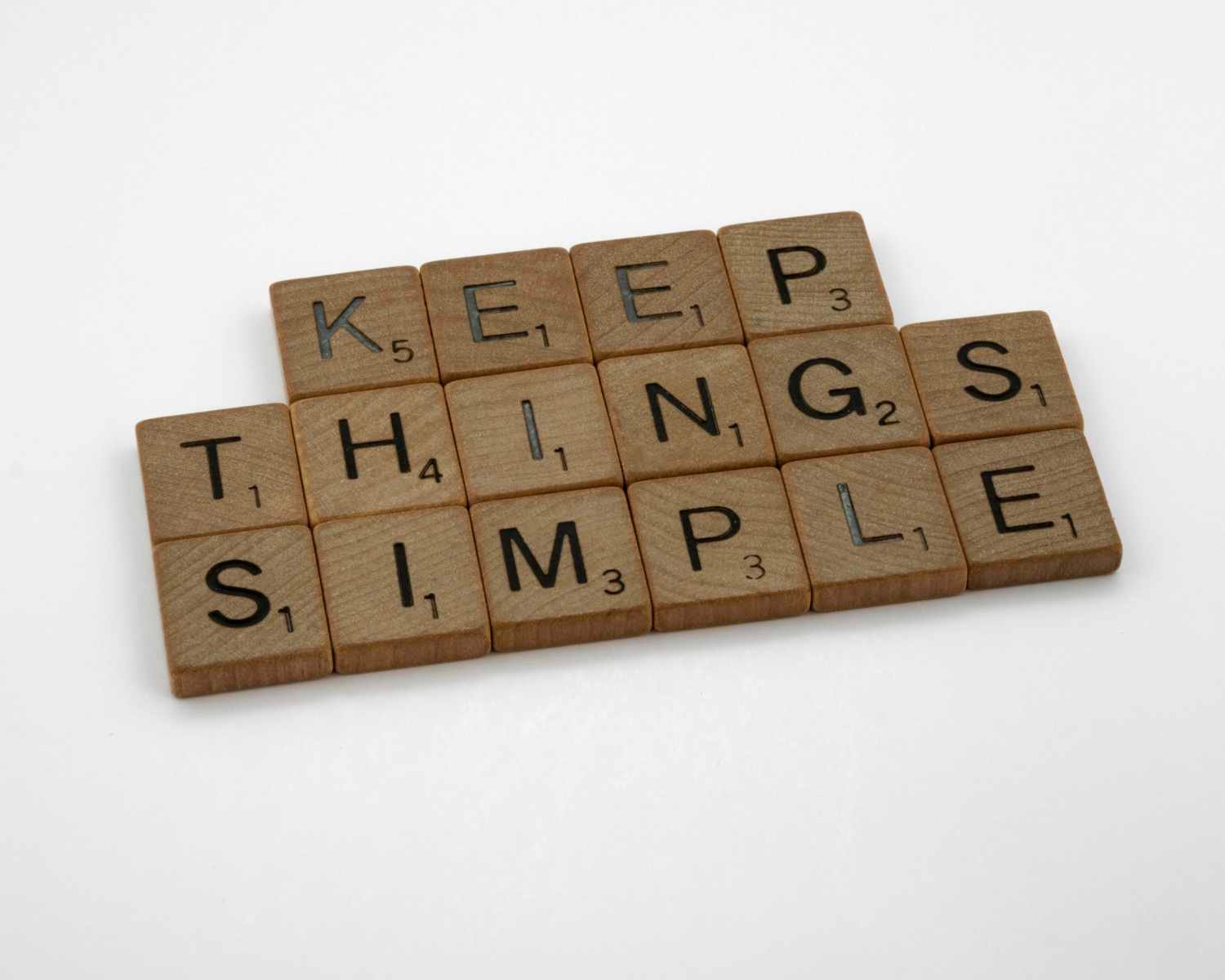 Scrabble tiles that spell out "Keep Things Simple"