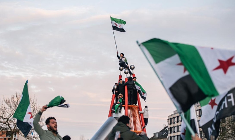 سوريون في ألمانيا يحتفلون بسقوط نظام بشار الأسد، 8 كانون الأول/ ديسمبر 2024 - Getty