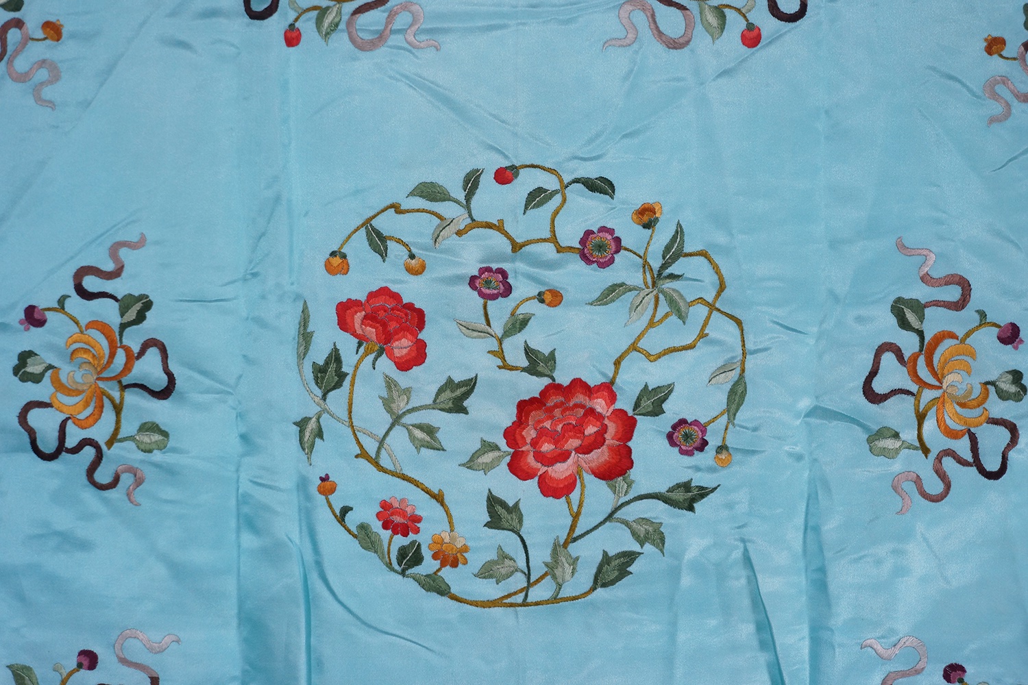 C. 1912-1949 民国 天蓝地刺绣四季花卉图锦衣
