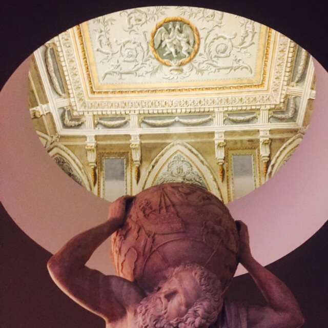 A sculpture in the Museo Nazionale looks up at the mural on the ceiling above.