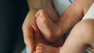 hand holding baby feet