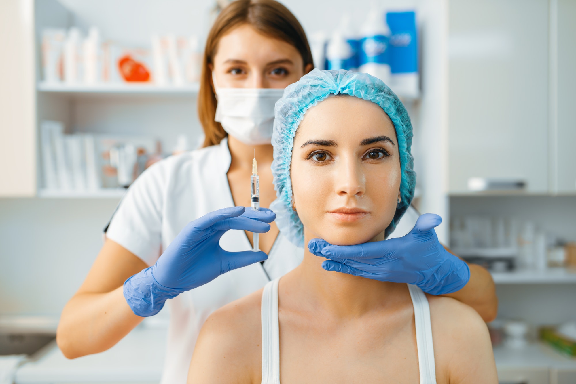 cosmetician-holds-syringe-with-injection-of-botox.jpg