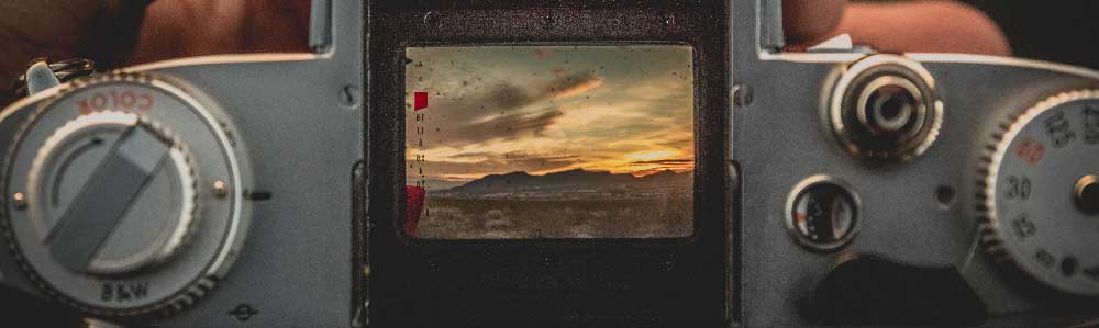 Looking through the viewfinder of a vintage camera.