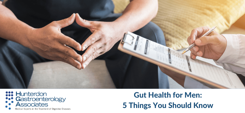 A person is seated, holding their hands together, while another person holding a pen writes on a clipboard. The text reads "Gut Health for Men: 5 Things You Should Know." The logo for Hunterdon Gastroenterology Associates is visible at the bottom left.