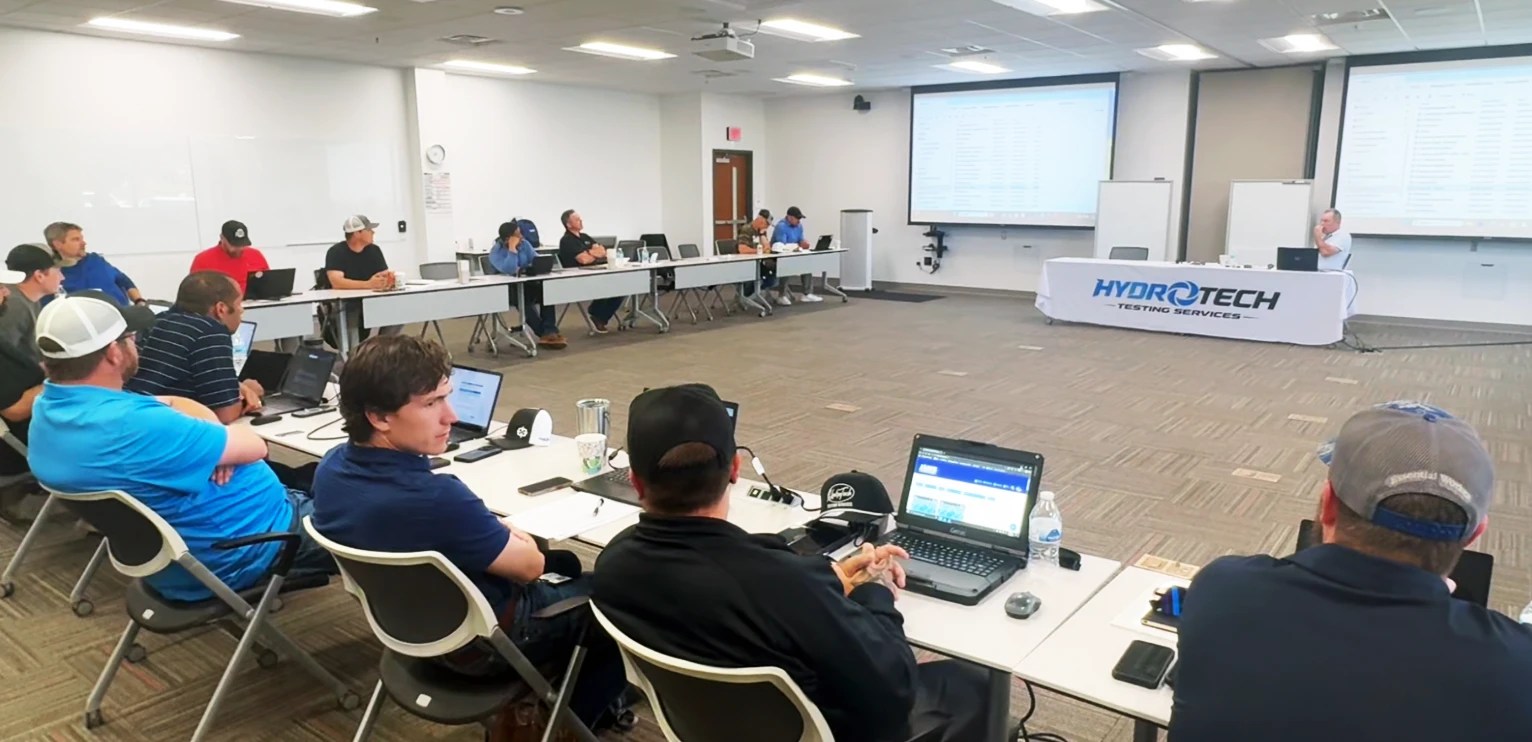 Large HydroTech hydrostatic testing training session with field crew on-site