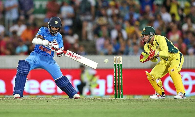 Shikhar Dhawan plays a shot against Australia. &mdash; AP