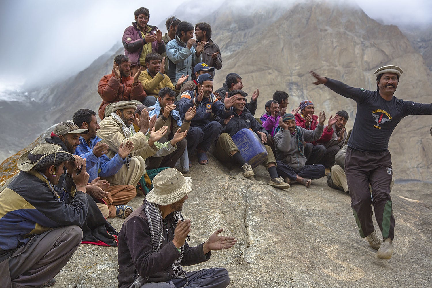 Porters singing and clapping as we celebrated Eid. A Pakistan Army officer stationed at Urdukas joined in the celebrations.