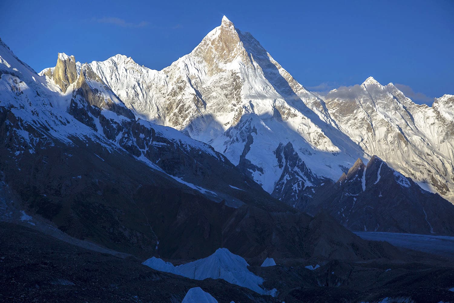 The first rays of the sun on the beautiful Masherbrum mountain.