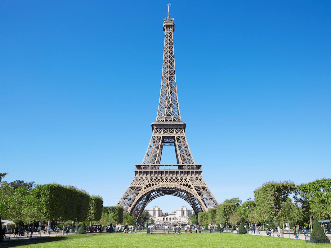The eiffel tower is an iron lattice tower located on the champ de mars in paris. Eiffel Tower Facts And History