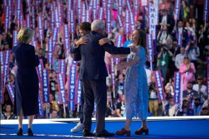 Tim Walz embracing his children at the DNC