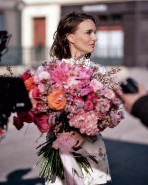 Natalie with flowers – via IG post Aug’26