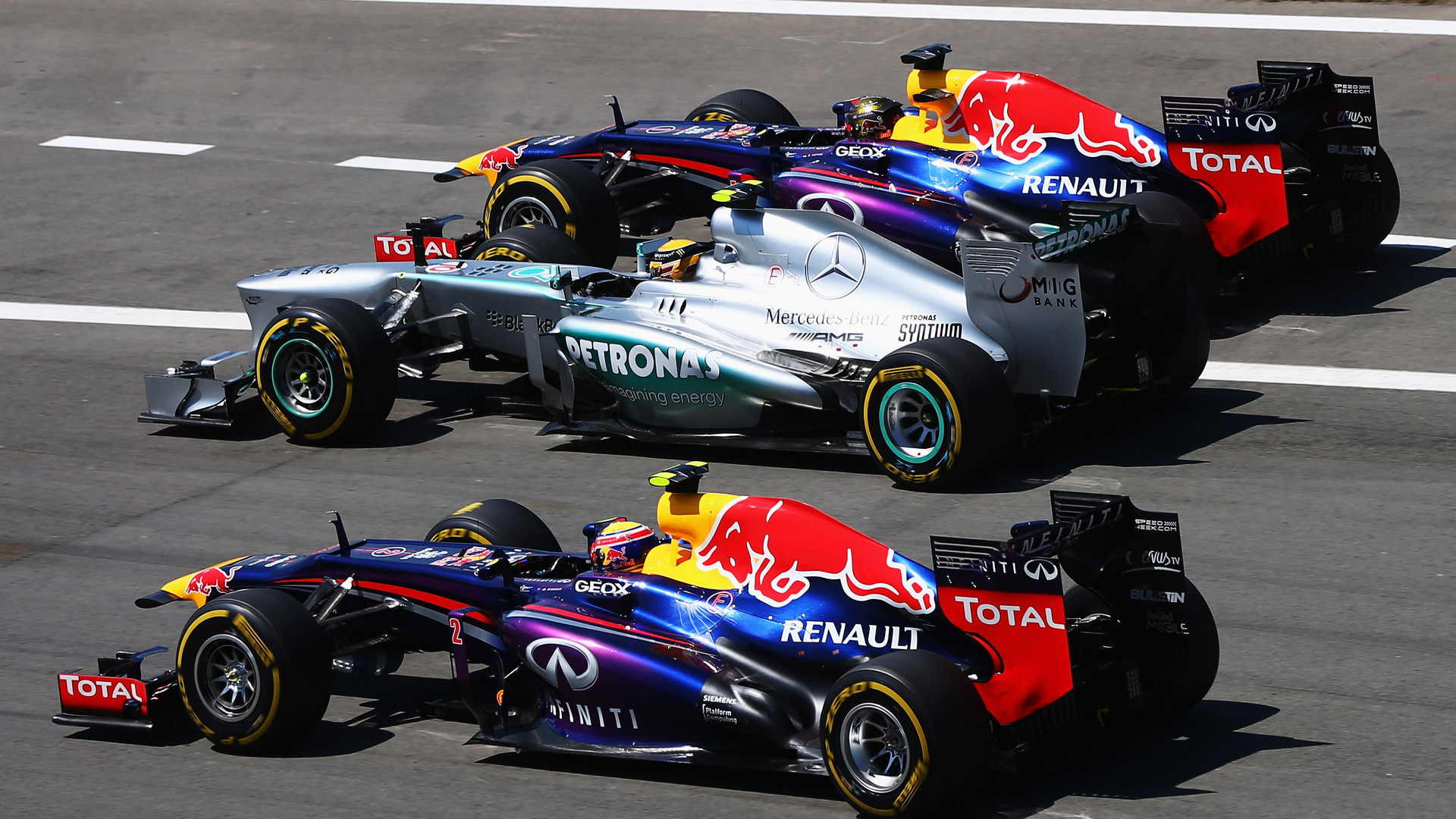 Mark Webber And Sebastian Vettel Passing Lewis Hamilton