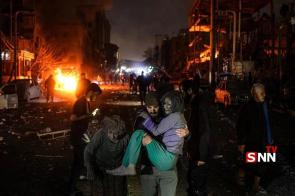 Iranian civillians during aftermath of Israeli bombings of Tehran, Niloufar square