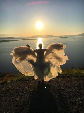 My wife fluffing her wedding dress on the big day.