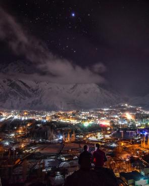 A starry night overlooking the glowing valley of Skardu, Pakistan.