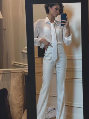 Mirror selfie in all white outfit – IG March 2026