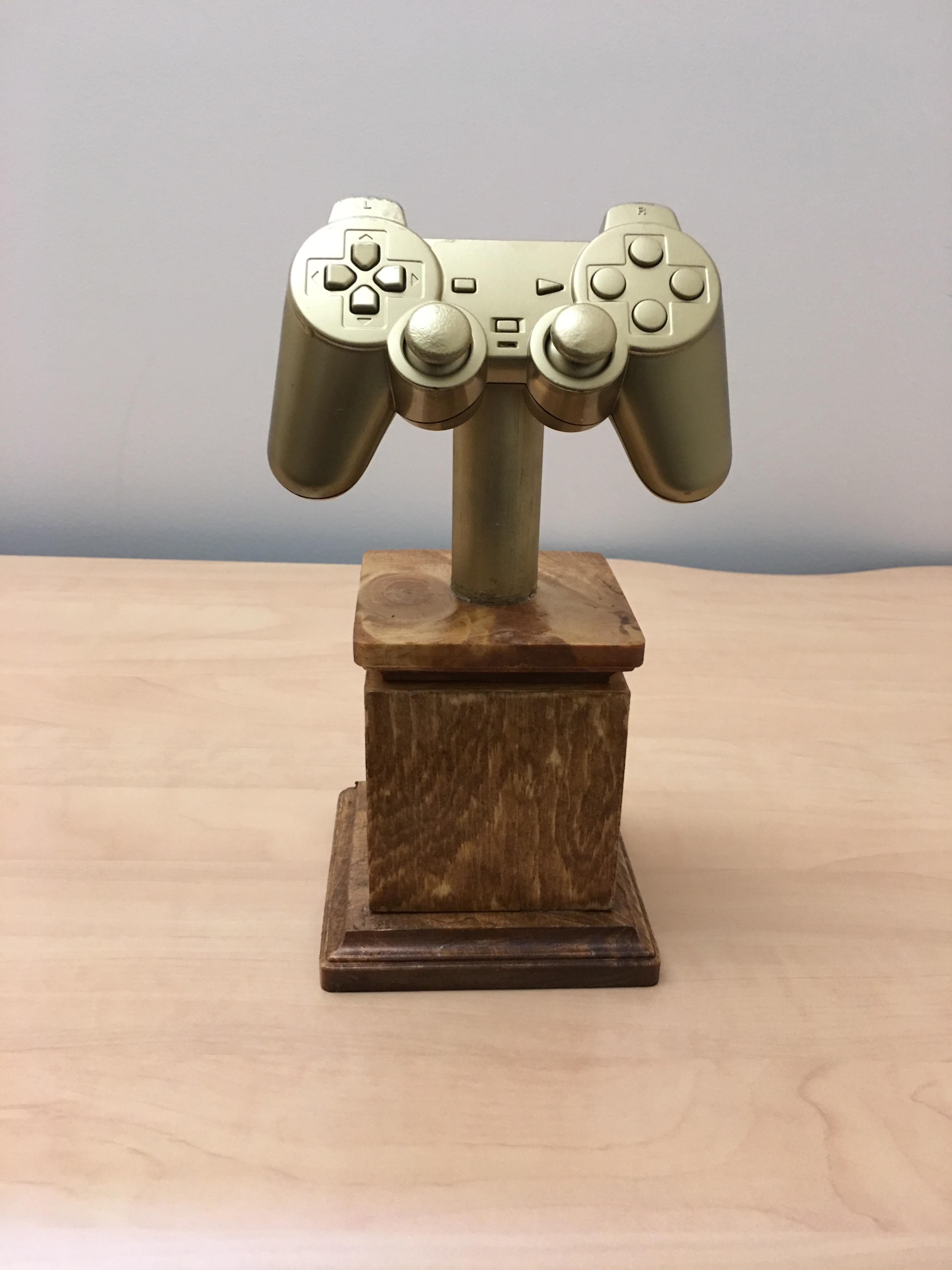 I noticed my ps4 controller's l2 trigger was sticking. We had a FIFA tourney at work and I made this trophy using